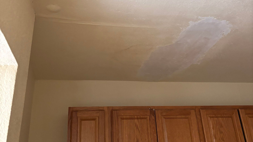 Water damage stain on ceiling from roof leak
